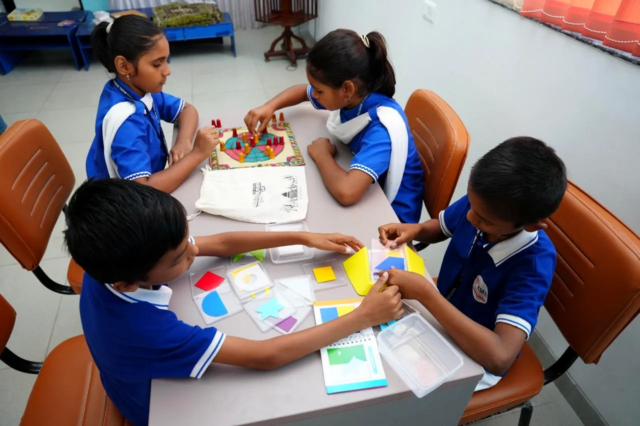Students working in a small group in the classroom